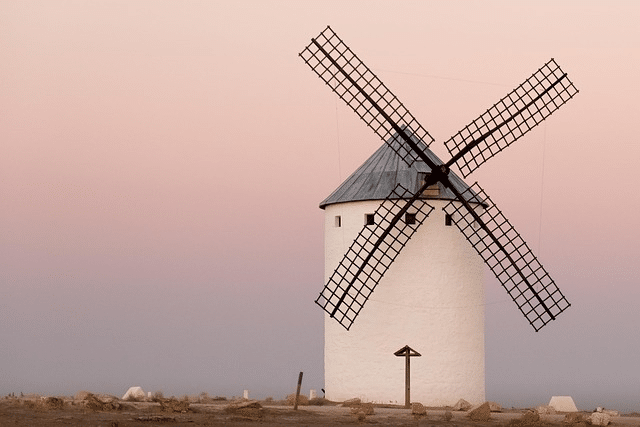 Tourne moulin, tourne à la place de mes pensées (un moulin sur un fond aux tons pastels).